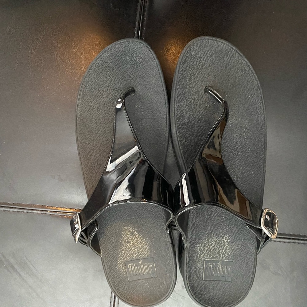 Patent leather flip flops with silver buckle